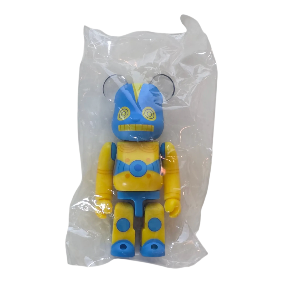 Bearbrick Series 45 H×S (Hirota Saigansho) "Softvinyl Toy" Yellow 100% SECRET in Folie